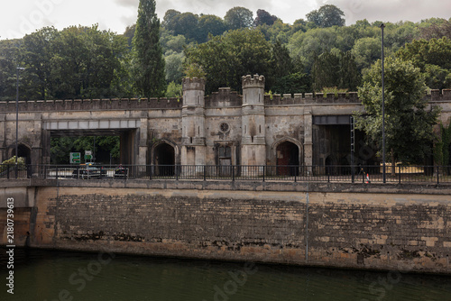 фотографія Crenellated gothic revival river frontage with turrets and pointed arches above the River Avon in Bath, Somerset