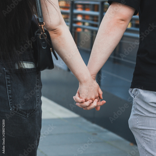 close up of a couple holding hands
