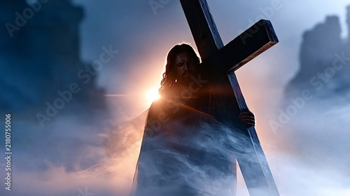 Jesus christ is carrying the wooden cross on his shoulder, walking through a spiritual light and atmospheric fog, representing sacrifice, faith, and the path to redemption