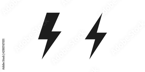 Bild auf Leinwand Two distinct lightning bolt icons in black solid style for weather alerts energy utility services or power concepts