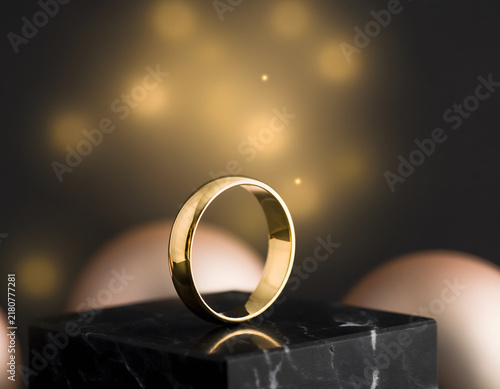 Holiday Luxury Jewelry: Luxurious solid gold ring beautifully displays an elegant, sparkling symbol of commitment