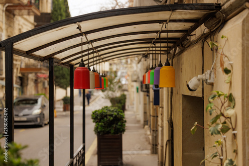 Cuadro en lienzo Colorful lamp shades brighten up a charming street in Baku, creating a vibrant a