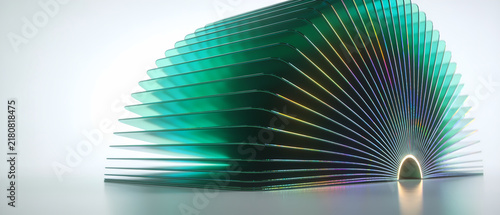 A circular series of translucent green acrylic sheets arranged in a fan formation casting colorful reflections and light refraction effects across the surface to create a sense of depth and