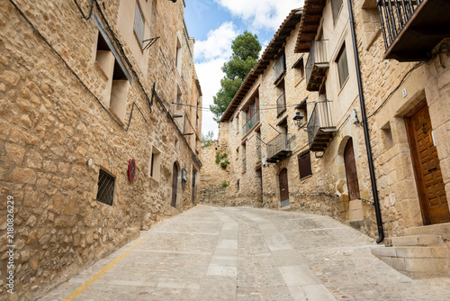 narrow street with typical houses in Valderrobres, Comarca of Matarrana, province of Teruel, Aragon, Spain