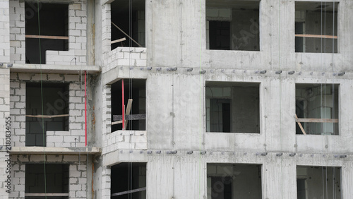 Cuadro en lienzo Exposed reinforced concrete frame and masonry walls during multistory building c