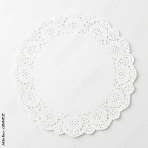 White paper lace doily isolated on white background