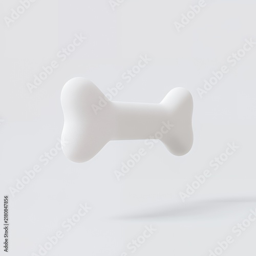 White dog bone floating in soft light