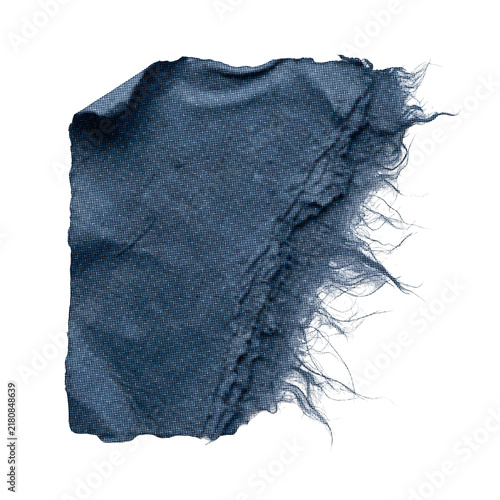 Torn indigo fabric swatch with frayed edges against a clean white background conveying a subtle paper tone texture