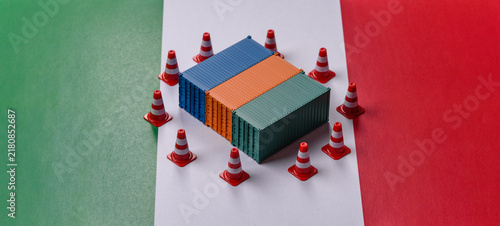 Fotografie The cargo container ban on the Italian flag as a conceptual backdrop