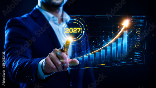 Businessman touching holographic growth chart 2027, Blue digital interface, Future financial predictions, Technology strategy, Analyzing success stats, Marketing graph trends