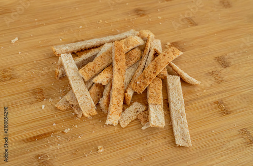 фотографія Cutting the crusts off, crustless bread for sandwiches closeup