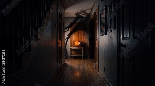 Spooky Halloween Pumpkin with Monster Shadow in Dark Hallway