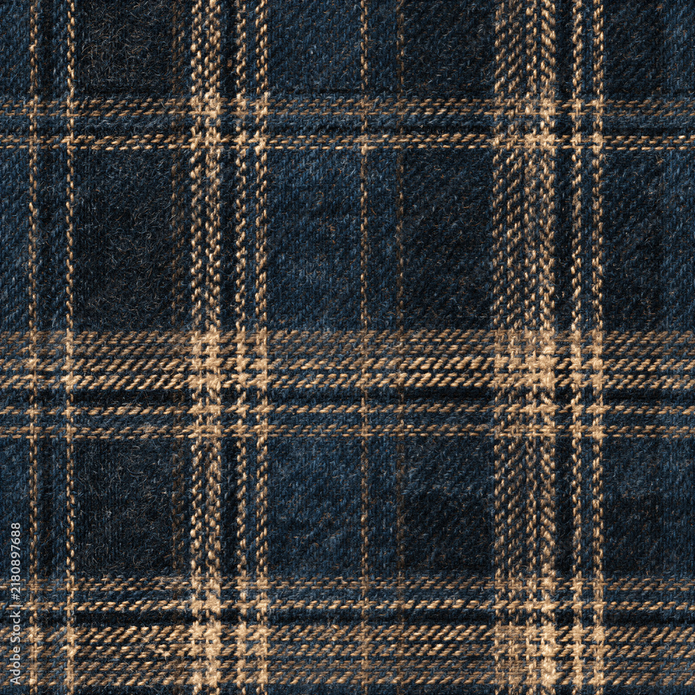 Fototapeta premium Seamless pattern woven wool textile showing a classic tartan check pattern in navy blue and beige. Repeating fabric texture with traditional design