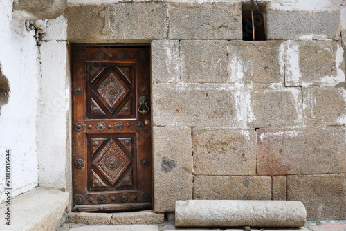 Typical houses with granite stone plinths and upper floors with geometric wooden frameworks and adobe in La Alberca town