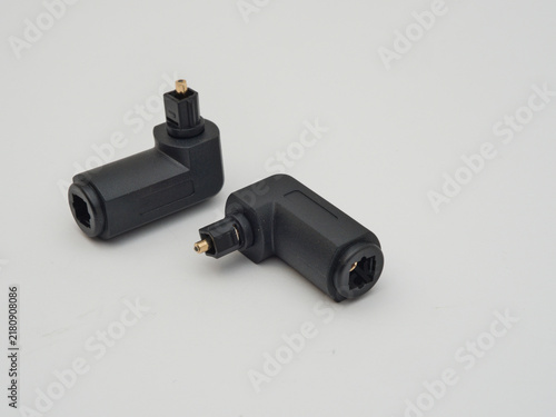 Bild auf Leinwand Two Right-Angle Toslink Optical Adapters - Two black right-angle Toslink optical