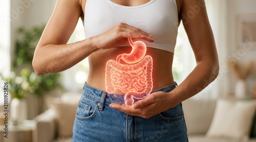 A glowing anatomical illustration of the gastrointestinal tract and digestive system on a woman's abdomen.