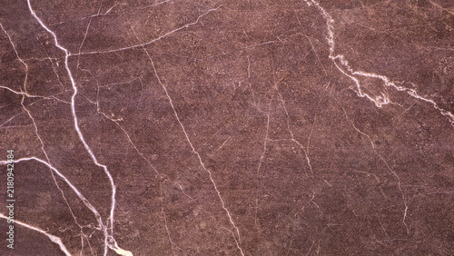 Obraz na plátně Close-up of brown earthy surface with white branching lines