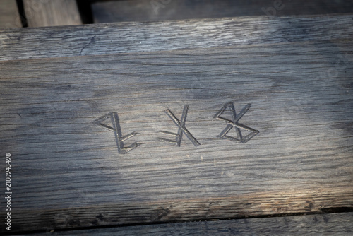 Viking runes engraved in wood