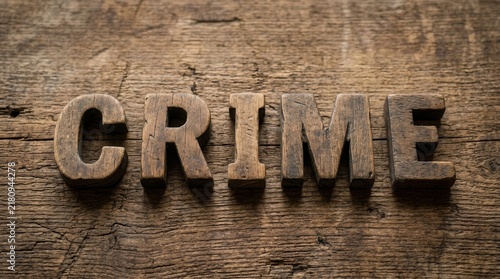 Rustic Wooden Letters Spell Crime On Textured Wood Background