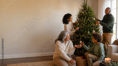Multigenerational Family Decorating Christmas Tree at Home