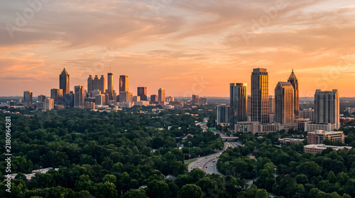 Atlanta skyline sunset aerial view with modern skyscrapers and lush green trees