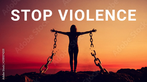 A silhouette of a woman breaking free from heavy chains under a dramatic sunset, symbolizing freedom, justice, and the end of violence.