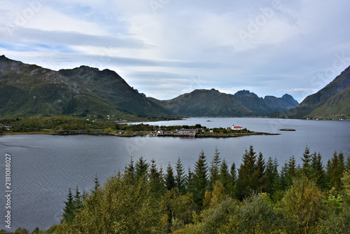 Panoramic image of the Austnesfjord with Sildpollnes Church and the Geitgaljartind mountain, Austvågøya island, Lofoten islands. Norway.