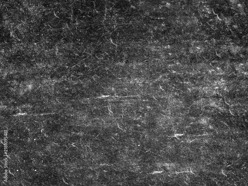 Grungy black surface with numerous white scratches and dust particles, creating a distressed and textured overlay for abstract or vintage designs.