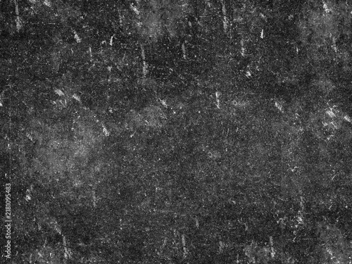 Grungy black surface with numerous white scratches and dust particles, creating a distressed and textured overlay for abstract or vintage designs.