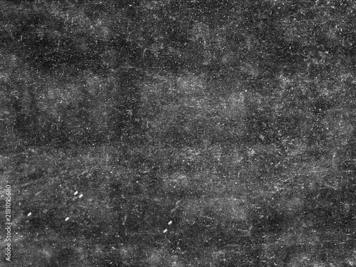 фотографія Grungy black surface with numerous white scratches and dust particles, creating a distressed and textured overlay for abstract or vintage designs