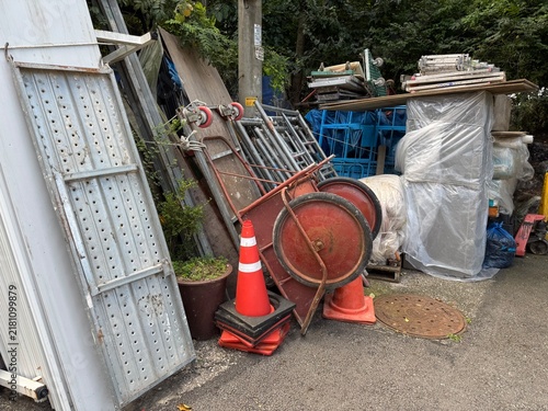 Construction equipment and scaffolding planks stored on street corner