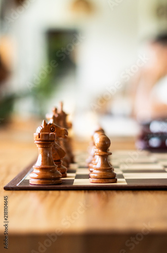 Fotografie Chess game with chess pieces on a chessboard