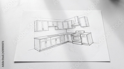 Hand drawn perspective sketch of a modern kitchen interior design layout with cabinets and appliances
