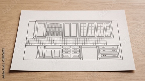 Architectural kitchen cabinet design drawing on paper over wooden table background