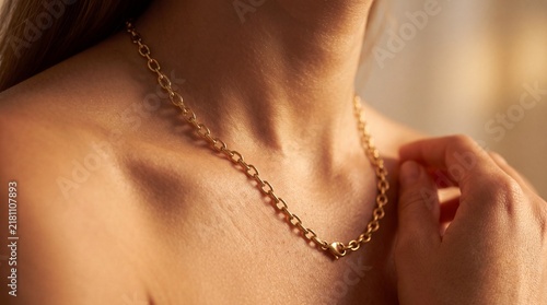 Elegant Gold Chain Necklace Worn by a Woman Enhancing Her Sophisticated Style and Radiance