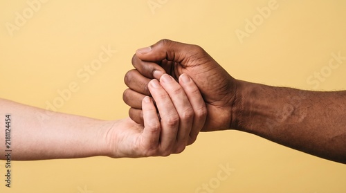 Diverse hands clasped together showing unity and connection
