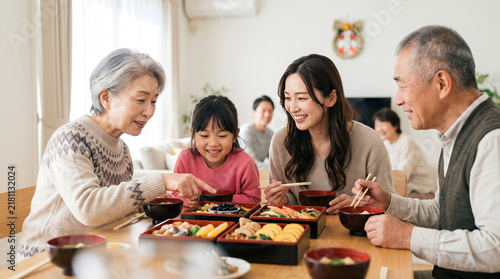 Fototapeta お正月におせち料理を囲んで笑顔で会食する3世代家族