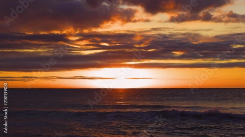 Dramatic Orange Sunset Over Ocean Horizon With Sun Setting cinematic