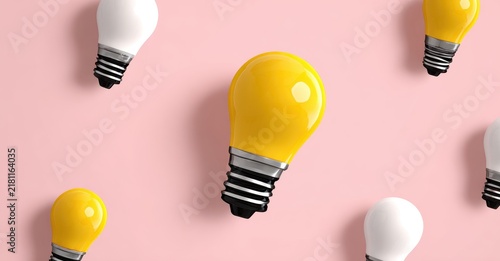 Yellow light bulb stands out from white bulbs on a pink background