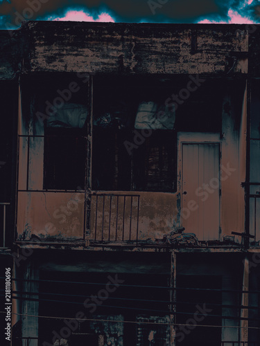 Принти на полотні Fire-Damaged Abandoned Apartment Balcony with Charred Walls Under Surreal Pink-T