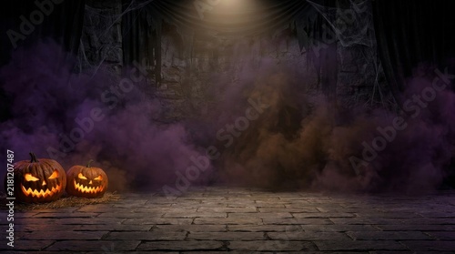 Two glowing carved pumpkins placed on a stone floor in a dark foggy room with draped curtains