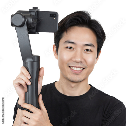 Vlogger gimbal smartphone smiling Asian man holding mobile stabilizer on a transparent background for digital content creation