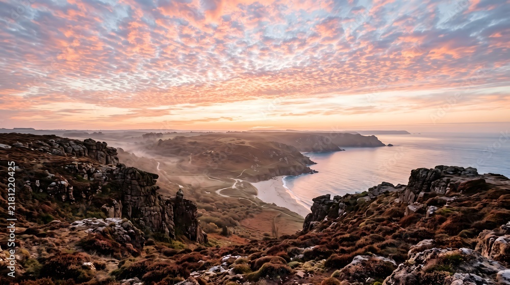 Obraz premium Rocky coastal highland overlooks a winding shoreline beneath a pastel sunrise sky, offering a dramatic natural landscape for travel, geology and outdoor editorial use.