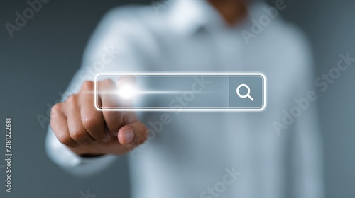 Person touching a digital search bar interface with magnifying glass