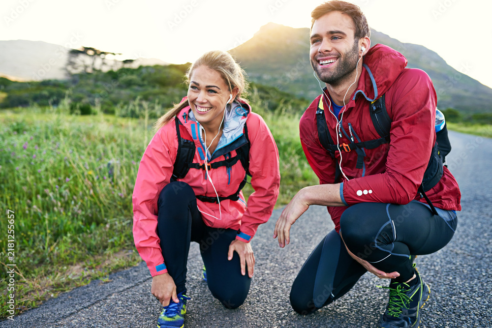 Obraz premium Exercise, road and thinking with couple in nature together for activity, bonding or cardio training. Fitness, relationship and vision with happy people outdoor on mountain path for start of workout
