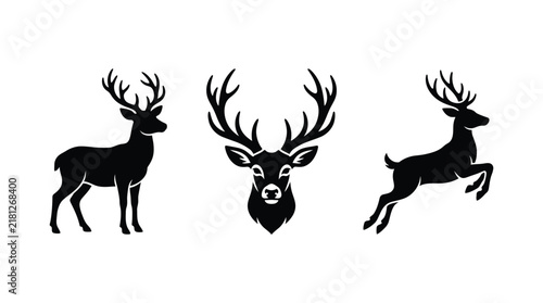 Black silhouettes of deer in standing