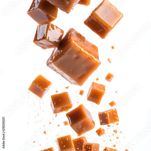 Falling Caramel Candy Cubes on Clean White Background