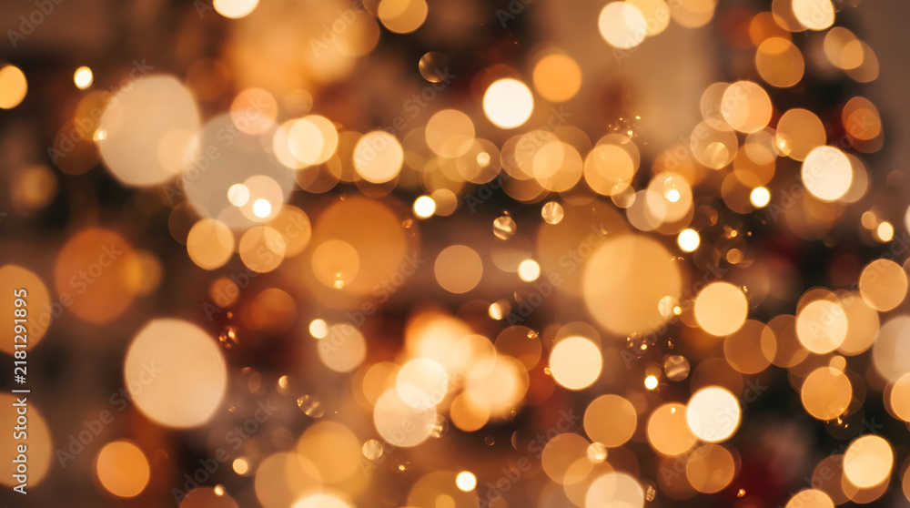Fototapeta premium Golden bokeh lights background with warm glow