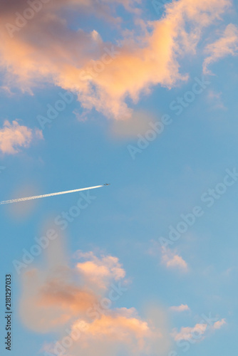 Bild auf Leinwand twin engined jet liner aircraft with contrails, in flight at high altitude, clea