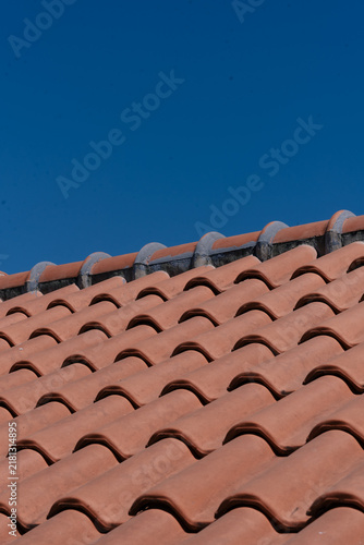 Obraz na płótnie Terracotta Roof Tiles Against Deep Blue Sky